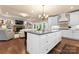 Open kitchen featuring a central island with quartz countertops and stainless appliances at 6010 Albiza Dr, Harrisburg, NC 28075