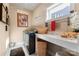 Bright laundry room with modern washer/dryer and ample counter space at 6010 Albiza Dr, Harrisburg, NC 28075