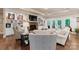 Comfortable living room with a fireplace, built-in shelving, and French doors at 6010 Albiza Dr, Harrisburg, NC 28075