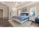 Main bedroom boasts tray ceilings, windows for natural light and hardwood flooring at 6010 Albiza Dr, Harrisburg, NC 28075