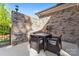 This outdoor patio features an outdoor dining set and brick wall, perfect for enjoying meals at 6010 Albiza Dr, Harrisburg, NC 28075