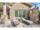 This outdoor patio features comfortable lounge chairs and plenty of sunlight, perfect for relaxation at 6010 Albiza Dr, Harrisburg, NC 28075