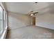 Bedroom with plush carpet, ceiling fan, and bright natural light at 6020 Gray Gate Ln # I, Charlotte, NC 28210