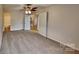 Bedroom featuring neutral carpet and direct access to an en-suite bathroom at 6020 Gray Gate Ln # I, Charlotte, NC 28210