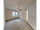 Spacious bedroom featuring carpet, ceiling fan, and natural light at 6020 Gray Gate Ln # I, Charlotte, NC 28210