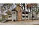 Inviting multi-level condo with brick chimney and private balconies surrounded by mature trees and fall foliage at 6020 Gray Gate Ln # I, Charlotte, NC 28210