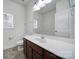 The bathroom features a wood vanity and a window for natural light at 6021 Piscataway Ct, Rock Hill, SC 29732