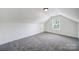 This bedroom features neutral paint, carpeting, and a window for natural light at 6021 Piscataway Ct, Rock Hill, SC 29732