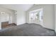 Cozy bedroom with plush carpeting, vaulted ceiling, and a bay window that provides natural light at 6021 Piscataway Ct, Rock Hill, SC 29732