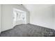 Bright bedroom featuring plush carpeting, a bay window that provides ample natural light, and freshly painted walls at 6021 Piscataway Ct, Rock Hill, SC 29732