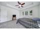 Bright bedroom boasts a ceiling fan, a TV, and large windows at 6021 Piscataway Ct, Rock Hill, SC 29732