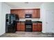 This open kitchen features stainless steel appliances, granite countertops, and custom wood cabinets at 6021 Piscataway Ct, Rock Hill, SC 29732