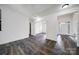 Bright living area featuring new hardwood flooring, white walls, and arched doorways with elegant trim at 6021 Piscataway Ct, Rock Hill, SC 29732