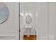 A clean, minimalist powder room featuring a pedestal sink and modern fixtures at 6171 Willow Farm Dr, Denver, NC 28037