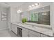 An elegant bathroom with a double vanity and a large mirror at 6171 Willow Farm Dr, Denver, NC 28037