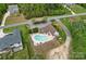 Aerial view of a private backyard featuring an in-ground pool and patio area, perfect for outdoor relaxation at 6171 Willow Farm Dr, Denver, NC 28037