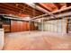 Unfinished basement offering space for storage or customization; featuring exposed ductwork at 619 E Sanders Rd, Shelby, NC 28150