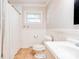 Bathroom featuring tiled flooring, wainscotting, a white toilet, vanity, and a shower with curtain at 619 E Sanders Rd, Shelby, NC 28150
