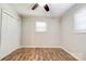 Simple bedroom with hardwood flooring, a ceiling fan, and a double-door closet at 619 E Sanders Rd, Shelby, NC 28150