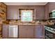 Kitchen features a stainless-steel dishwasher, oven, and plenty of cabinets at 619 E Sanders Rd, Shelby, NC 28150