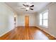 A spacious living room with hardwood floors, a ceiling fan and large window at 619 E Sanders Rd, Shelby, NC 28150