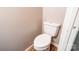 Plain toilet features a white porcelain design and wood-look flooring at 619 E Sanders Rd, Shelby, NC 28150