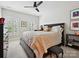 Comfortable bedroom with natural light, soft carpet, and ceiling fan at 6309 Wakehurst Rd, Charlotte, NC 28226