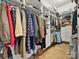 Walk-in closet with custom shelving and hanging racks for ample storage at 6309 Wakehurst Rd, Charlotte, NC 28226