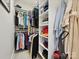 Walk-in closet with custom shelving and hanging racks at 6309 Wakehurst Rd, Charlotte, NC 28226