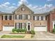Charming brick townhome with black shutters, well-maintained landscaping, and a welcoming entrance at 6309 Wakehurst Rd, Charlotte, NC 28226