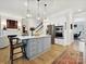 Modern kitchen with stainless steel appliances, custom cabinetry, and a quartz-topped center island at 6309 Wakehurst Rd, Charlotte, NC 28226