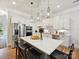 Modern kitchen featuring a large island, stainless steel appliances, and stylish pendant lighting at 6309 Wakehurst Rd, Charlotte, NC 28226