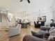 Open concept living room flows into the kitchen, with natural light and modern furnishings at 6309 Wakehurst Rd, Charlotte, NC 28226