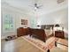 Spacious bedroom featuring hardwood floors, plantation shutters, and elegant furnishings at 6309 Wakehurst Rd, Charlotte, NC 28226