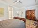 Comfortable bedroom with hardwood floors and a view into the ensuite bathroom at 6309 Wakehurst Rd, Charlotte, NC 28226