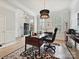 Spacious office with natural light, desk, stylish decor, and hardwood floors, great for working from home at 6309 Wakehurst Rd, Charlotte, NC 28226