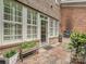 Private brick-paved outdoor patio with grill area just outside the door to the indoor living space at 6309 Wakehurst Rd, Charlotte, NC 28226