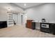 Basement kitchenette with bar and view of sliding barn door at 685 Knollcrest Ne Dr, Concord, NC 28025