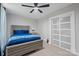 Modern bedroom featuring a blue bedspread and sliding closet doors at 685 Knollcrest Ne Dr, Concord, NC 28025