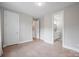 Large bedroom with open doorway to bathroom at 685 Knollcrest Ne Dr, Concord, NC 28025