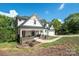 Charming two-story home with a covered front porch and well-manicured lawn at 685 Knollcrest Ne Dr, Concord, NC 28025