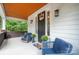Inviting front porch with seating and a decorated front door at 685 Knollcrest Ne Dr, Concord, NC 28025