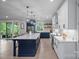 Beautiful kitchen with white cabinets, a large island with pendant lighting, and modern appliances at 685 Knollcrest Ne Dr, Concord, NC 28025
