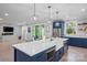 Modern kitchen with a white countertop island, stainless steel appliances, and stylish decor at 685 Knollcrest Ne Dr, Concord, NC 28025
