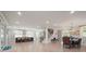 Open-concept living space with modern lighting, light wood floors, and direct access to the kitchen at 685 Knollcrest Ne Dr, Concord, NC 28025