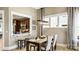 Charming dining area with modern light fixtures and a view to the kitchen at 7324 Jolly Brook Dr, Charlotte, NC 28215