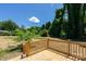 Backyard with spacious deck, lush landscaping, and mature trees providing great privacy at 7426 Hambright Rd, Huntersville, NC 28078