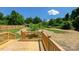 Backyard with spacious deck and lush landscaping, perfect for outdoor entertaining at 7426 Hambright Rd, Huntersville, NC 28078