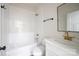 Beautiful bathroom features white subway tiles, marble countertop and brass fixtures at 7426 Hambright Rd, Huntersville, NC 28078