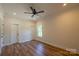 Bright bedroom with wood floors, modern lighting, and ample closet space at 7426 Hambright Rd, Huntersville, NC 28078